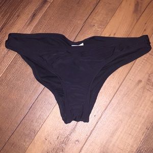 Cheeky black bathing suit bottoms